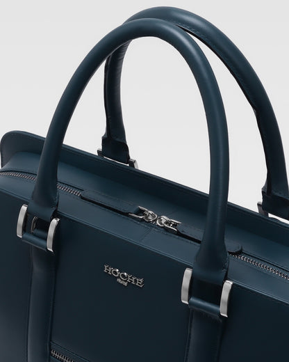 Close-up of PinnaclePro dark blue leather laptop bag for men, highlighting the rich leather texture, precision stitching, and custom metal hardware.