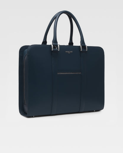 Side profile of PinnaclePro dark blue leather laptop bag for men, showcasing its slim, structured design and high-quality craftsmanship