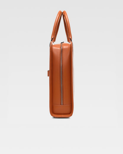 side view of PinnaclePro Umber Tan genuine leather laptop bag for men in India, highlighting rich full-grain leather, premium metal hardware, and expert stitching