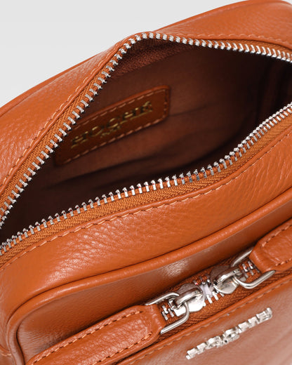 Close-up of Umber Tan genuine leather on men’s sling bag – Grandeur by Hoche Paris