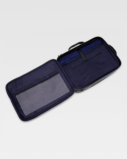Open view of UniSwitch black branded genuine leather backpack for men in India, showcasing spacious compartments, a padded laptop sleeve, and secure storage