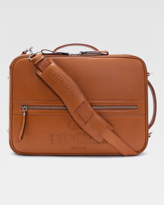Briefcase view of UniSwitch tan branded genuine leather 3 in 1 convertible genuine leather backpack for men in India, featuring ergonomic padded straps and a hidden trolley sleeve.